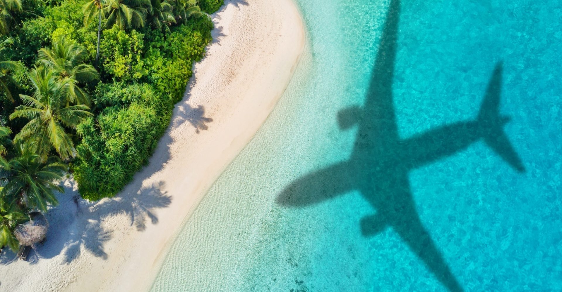 Travel,Concept,With,Airplane,Shadow,And,Tropical,Beach.,Tropical,Paradise